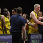 
              Australia's Lauren Jackson, second right, hugs her coach Sandy Brondello at the end of their bronze medal game against Canada at the women's Basketball World Cup in Sydney, Australia, Saturday, Oct. 1, 2022. (AP Photo/Rick Rycroft)
            