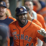 
              Houston Astros' Yordan Alvarez celebrates with teammates in the dugout after hitting a home run against the Oakland Athletics during the third inning of a baseball game Friday, Sept. 16, 2022, in Houston. (AP Photo/David J. Phillip)
            