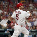 
              St. Louis Cardinals' Albert Pujols follows through on an RBI single during the first inning of a baseball game against the Milwaukee Brewers Tuesday, Sept. 13, 2022, in St. Louis. (AP Photo/Jeff Roberson)
            