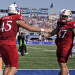 
              Kansas tight end Trevor Kardell (45) celebrates with tight end Jared Casey (47) after scoring a touchdown during the first half of an NCAA college football game against Duke Saturday, Sept. 24, 2022, in Lawrence, Kan. (AP Photo/Charlie Riedel)
            