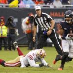 
              Chicago Bears' Justin Fields runs past San Francisco 49ers' Samson Ebukam during the first half of an NFL football game Sunday, Sept. 11, 2022, in Chicago. (AP Photo/Charles Rex Arbogast)
            