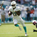 
              Miami Dolphins wide receiver Jaylen Waddle (17) runs for a touchdown during the first half of an NFL football game against the New England Patriots, Sunday, Sept. 11, 2022, in Miami Gardens, Fla. (AP Photo/Lynne Sladky)
            