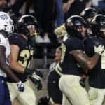 
              Purdue safety Cam Allen (10) celebrates after intercepting a Florida Atlantic pass during an NCAA college football game Saturday, Sept. 24, 2022, in West Lafayette, Ind. (Alex Martin/Journal & Courier via AP)
            