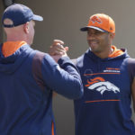 
              Denver Broncos head coach Nathaniel Hackett, left, greets quarterback Russell Wilson as he heads to a news conference before the NFL football team's practice Thursday, Sept. 8, 2022, at the Broncos' headquarters in Centennial, Colo. The Broncos open the NFL season Monday night against the Seahawks in Seattle. (AP Photo/David Zalubowski)
            