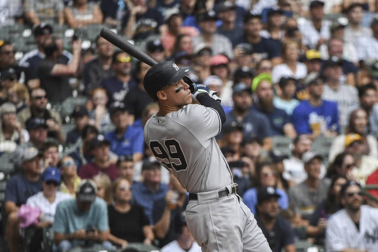 New York Yankees' Aaron Judge hits his fifty eighth homerun during the third inning of a baseball g...