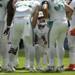 
              Miami Dolphins quarterback Tua Tagovailoa (1) talks to the offensive line during the first half of an NFL football game against the Buffalo Bills, Sunday, Sept. 25, 2022, in Miami Gardens, Fla. (AP Photo/Rebecca Blackwell)
            