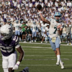 
              Tulane quarterback Michael Pratt throws for a touchdown during the second half of an NCAA college football game against Kansas State Saturday, Sept. 17, 2022, in Manhattan, Kan. Tulane won 17-10. (AP Photo/Charlie Riedel)
            