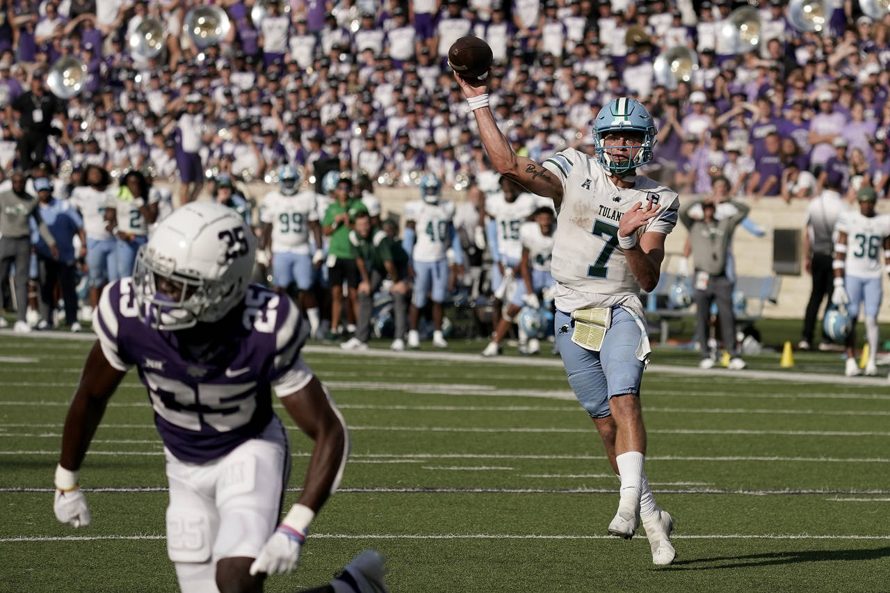 Tulane quarterback Michael Pratt throws for a touchdown during the second half of an NCAA college f...