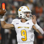 
              Chattanooga quarterback Preston Hutchinson looks for a receiver during the first half of the team's NCAA college football game against Illinois on Thursday, Sept. 22, 2022, in Champaign, Ill. (AP Photo/Charles Rex Arbogast)
            
