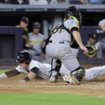 
              New York Yankees' Harrison Bader scores ahead of the tag by Pittsburgh Pirates catcher Jason Delay (61) during the fifth inning of a baseball game Tuesday, Sept. 20, 2022, in New York. (AP Photo/Jessie Alcheh)
            