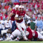 
              Nebraska quarterback Casey Thompson, center, breaks through Georgia Southern defenders to score during the first half of an NCAA college football game Saturday, Sept. 10, 2022, in Lincoln, Neb. (AP Photo/Rebecca S. Gratz)
            