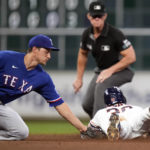 
              Houston Astros' Kyle Tucker, right, steals second as Texas Rangers shortstop Corey Seager applies the tag during the fourth inning of a baseball game Tuesday, Sept. 6, 2022, in Houston. (AP Photo/Eric Christian Smith)
            