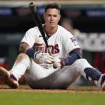 
              Minnesota Twins' Jose Miranda sits up after falling to the ground while avoiding a pitch during the eighth inning of the team's baseball game against the Cleveland Guardians, Friday, Sept. 9, 2022, in Minneapolis. (AP Photo/Abbie Parr)
            