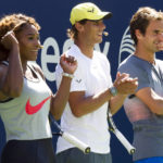 
              FILE - Serena Williams, Rafael Nadal and Roger Federer, right, cheer on the competition during Arthur Ashe Kids' Day, the kick off to the U.S. Open tennis tournament, Aug. 24, 2013, in New York. Some older fans in particular — middle-aged, or beyond — said they saw in Williams’ latest run at the 2022 U.S. Open a very human and relatable takeaway. Namely the idea that they, also, could perform better and longer than they once thought possible — through fitness, practice and grit. (Photo by Charles Sykes/Invision/AP, File)
            