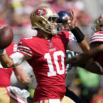 
              San Francisco 49ers quarterback Jimmy Garoppolo (10) passes against the Seattle Seahawks during the first half of an NFL football game in Santa Clara, Calif., Sunday, Sept. 18, 2022. (AP Photo/Tony Avelar)
            