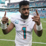 
              Miami Dolphins quarterback Tua Tagovailoa (1) gestures at the end of an NFL football game against the Buffalo Bills, Sunday, Sept. 25, 2022, in Miami Gardens, Fla. The Dolphins defeated the Bills 21-19. (AP Photo/Wilfredo Lee )
            