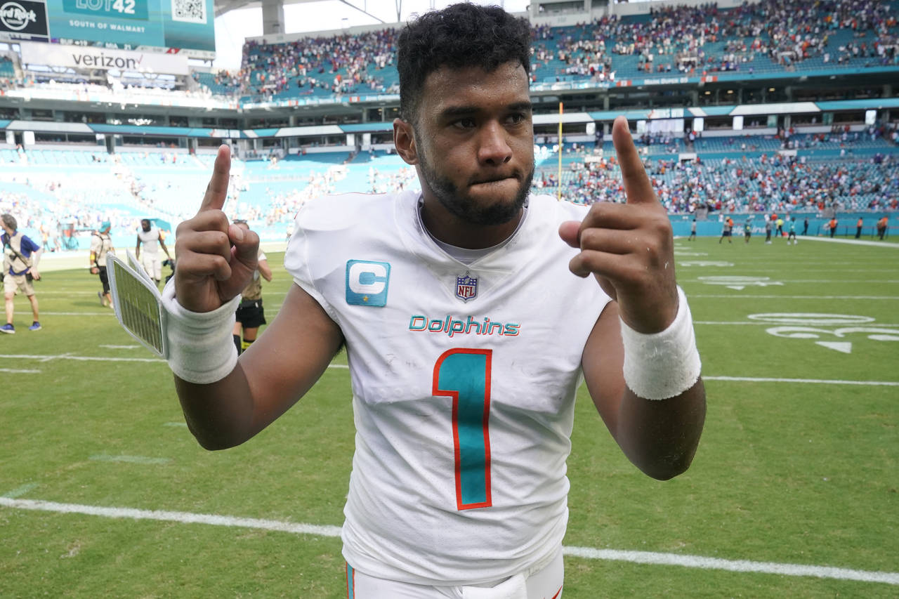 Miami Dolphins quarterback Tua Tagovailoa (1) gestures at the end of an NFL football game against t...