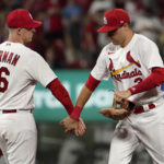 
              St. Louis Cardinals' Dylan Carlson, right, and Nolan Gorman (16) celebrate a 4-1 victory over the Washington Nationals in a baseball game Tuesday, Sept. 6, 2022, in St. Louis. (AP Photo/Jeff Roberson)
            