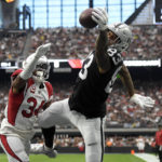 
              Las Vegas Raiders tight end Darren Waller (83) reaches for a ball in the end zone but cannot make the catch next to Arizona Cardinals safety Jalen Thompson during the first half of an NFL football game Sunday, Sept. 18, 2022, in Las Vegas. (AP Photo/David Becker)
            