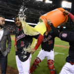
              Washington Nationals' CJ Abrams (5) gets doused by Ildemaro Vargas (14) and Tres Barrera (38) after the team's baseball game against the Atlanta Braves, Wednesday, Sept. 28, 2022, in Washington. Abrams hit a single to score Alex Call with the winning run. The Nationals won 3-2 in 10 innings. (AP Photo/Nick Wass)
            