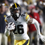 
              Iowa defensive back Kaevon Merriweather (26) returns a fumble for a touchdown against Rutgers during the first half of an NCAA football game, Saturday, Sept. 24, 2022, in Piscataway, N.J. (AP Photo/Noah K. Murray)
            