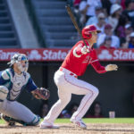 
              Los Angeles Angels designated hitter Shohei Ohtani, front right, grounds out as Seattle Mariners catcher Cal Raleigh, left, looks on during the seventh inning of a baseball game in Anaheim, Calif., Sunday, Sept. 18, 2022. (AP Photo/Alex Gallardo)
            