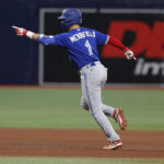 
              Toronto Blue Jays' Whit Merrifield circles the bases on a three-run home run against the Tampa Bay Rays during the seventh inning of a baseball game Saturday, Sept. 24, 2022, in St. Petersburg, Fla. (AP Photo/Scott Audette)
            