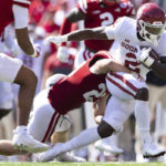 
              Oklahoma's Jovantae Barnes (2) rushes against Nebraska's Isaac Gifford (23) during the second half of an NCAA college football game Saturday, Sept. 17, 2022, in Lincoln, Neb. (AP Photo/Rebecca S. Gratz)
            