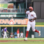 
              Cincinnati Reds' Aristides Aquino flexes as he runs the bases after hitting a grand slam during the sixth inning of the second game of a baseball doubleheader against the Colorado Rockies in Cincinnati, Sunday, Sept. 4, 2022. (AP Photo/Aaron Doster)
            