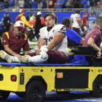 
              Washington Commanders center Chase Roullier (73) is taken out of the field for injury during the second half of an NFL football game against the Detroit Lions Sunday, Sept. 18, 2022, in Detroit. (AP Photo/Lon Horwedel)
            