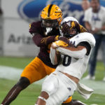 
              Arizona State defensive back Ro Torrence tackles Northern Arizona wide receiver Coleman Owen (6) during the first half of an NCAA college football game Thursday, Sept. 1, 2022, in Tempe, Ariz. (AP Photo/Rick Scuteri)
            
