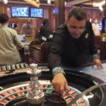 
              A dealer prepared to spin the ball during a game of roulette at the Hard Rock casino in Atlantic City N.J. on Aug. 8, 2022. On Sept. 16, 2022, New Jersey gambling regulators reported that the state's casinos, horse tracks that offer sports betting and the online partners of both types of gambling outlets won $470.6 million from gamblers in August, up nearly 10% from a year earlier. (AP Photo/Wayne Parry)
            
