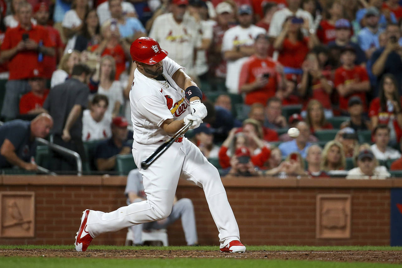 St. Louis Cardinals' Albert Pujols hits a two-run home run during the sixth inning of a baseball ga...