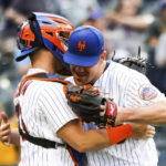 
              New York Mets' relief pitcher Trevor May hugs catcher Tomas Nido after they defeated the Pittsburgh Pirates in a baseball game, Sunday, Sept. 18, 2022, in New York. (AP Photo/Julia Nikhinson)
            