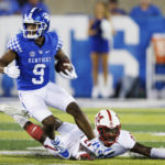 
              Kentucky wide receiver Tayvion Robinson (9) runs the ball up the field while Miami (Ohio) defensive back Michael Dowell (21) falls short of a tackle during the second half of an NCAA college football game in Lexington, Ky., Saturday, Sept. 3, 2022. (AP Photo/Michael Clubb)
            