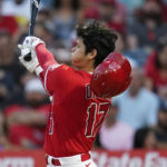 
              Los Angeles Angels designated hitter Shohei Ohtani (17) loses his helmet while swinging a strike during the first inning of a baseball game against the Houston Astros in Anaheim, Calif., Friday, Sept. 2, 2022. (AP Photo/Ashley Landis)
            