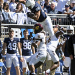 
              Penn State tight end Brenton Strange (86) hurdles Central Michigan defenders Lavario Wiley (6) and Justin Whiteside (45) during the first half of an NCAA college football game, Saturday, Sept. 24, 2022, in State College, Pa. (AP Photo/Barry Reeger)
            