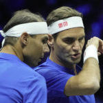 
              Team Europe's Roger Federer, right, and Rafael Nadal chat during their Laver Cup doubles match against Team World's Jack Sock and Frances Tiafoe at the O2 arena in London, Friday, Sept. 23, 2022. (AP Photo/Kin Cheung)
            
