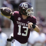 
              Texas A&M quarterback Haynes King (13) rolls out to pass against Appalachian State during the first quarter of an NCAA college football game Saturday, Sept. 10, 2022, in College Station, Texas. (AP Photo/Sam Craft)
            