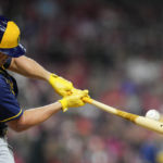 
              Milwaukee Brewers' Hunter Renfroe hits a two-run home run during the fifth inning of a baseball game against the Cincinnati Reds, Saturday, Sept. 24, 2022, in Cincinnati. (AP Photo/Jeff Dean)
            