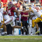 
              Alabama's Brian Branch (14) returns a punt past Louisiana-Monroe punter Devyn McCormick (34) for a touchdown during the second half of an NCAA college football game Saturday, Sept. 17, 2022, in Tuscaloosa, Ala. (AP Photo/Vasha Hunt)
            