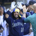 
              Seattle Mariners' Eugenio Suarez celebrates his home run against the Chicago White Sox during the seventh inning of a baseball game Wednesday, Sept. 7, 2022, in Seattle. (AP Photo/Caean Couto)
            