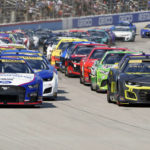 
              Joey Logano (22) and William Byron (24) lead the pack on a restart during the NASCAR Cup Series auto race at Texas Motor Speedway in Fort Worth, Texas, Sunday, Sept. 25, 2022. (AP Photo/Larry Papke)
            