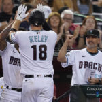 
              Arizona Diamondbacks' Carson Kelly (18) celebrates his home run against the San Diego Padres during the seventh inning of a baseball game, Thursday, Sept. 15, 2022, in Phoenix. (AP Photo/Matt York)
            