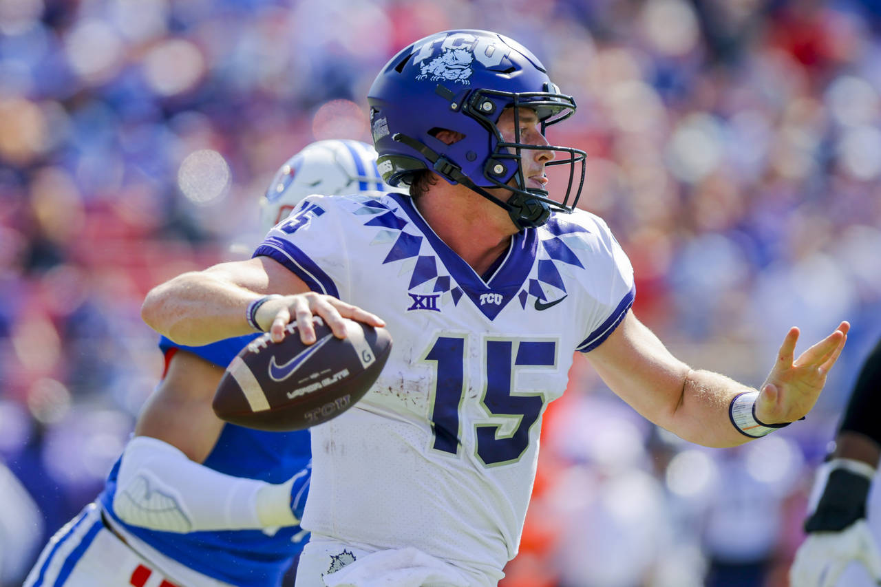 TCU quarterback Max Duggan (15) looks to pass during the first half of an NCAA college game against...