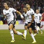 
              Fulham's Joao Palhinha, left, celebrates scoring their side's second goal of the game with team-mates during the English Premier League soccer match between Nottingham Forest and Fulham, at The City Ground, Nottingham, England, Friday Sept. 16, 2022. (Tim Good/PA via AP)
            