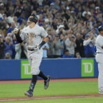 
              New York Yankees' Aaron Judge celebrates his 61st home run of the season, a two-run shot against the Toronto Blue Jays during the seventh inning of a baseball game Wednesday, Sept. 28, 2022, in Toronto. (Nathan Denette/The Canadian Press via AP)
            