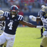 
              Mississippi running back Quinshon Judkins (4) runs the ball past Tulsa safety Daiquain Jackson (9) during the first half of an NCAA college football game in Oxford, Miss., Saturday, Sept. 24, 2022. (AP Photo/Thomas Graning)
            