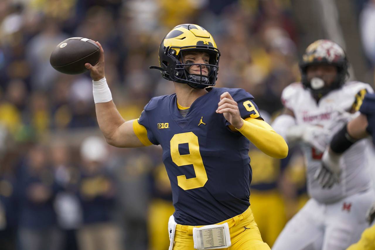Michigan quarterback J.J. McCarthy throws against Maryland in the second half of an NCAA college fo...