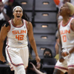 
              Connecticut Sun center Brionna Jones, left, reacts toward teammate Courtney Williams during Game 3 of a WNBA basketball semifinal playoff series, Sunday, Sept. 4, 2022, in Uncasville, Conn. (AP Photo/Jessica Hill)
            